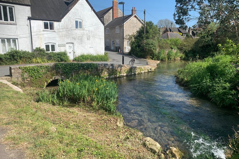 Looking downstream on the River Wey towards the corner of Mill Street  Upwey