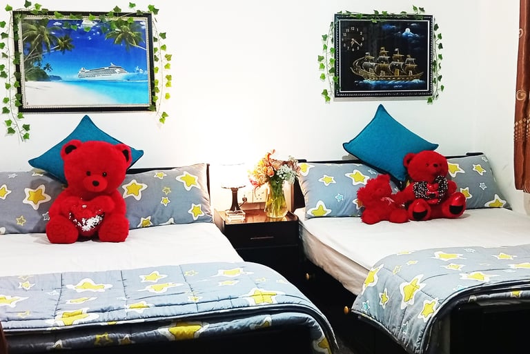 Family room at Nobel Bungalow Nuwara Eliya with double beds and teddy bears – cozy for families