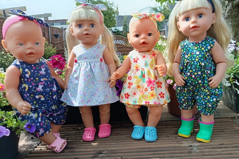 Baby Born and Big Sister dolls dressed in summer outfits