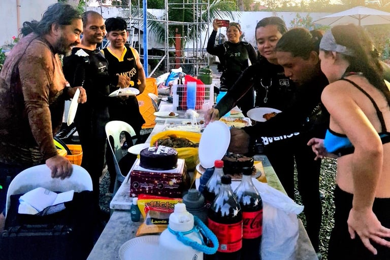 scuba divers preparing the food for lunch