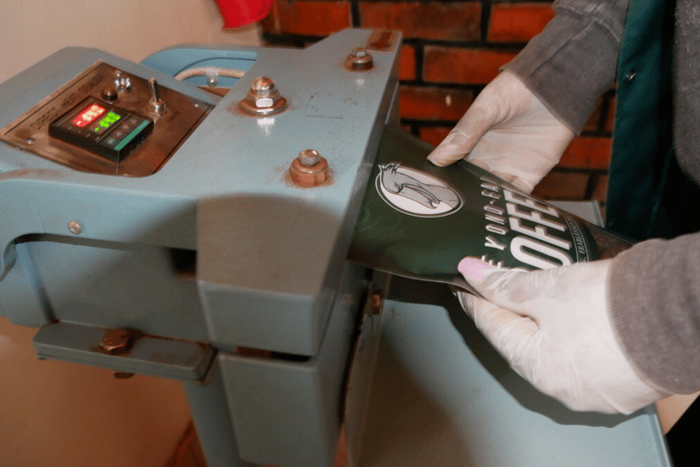 sealing a coffee bag witha manual machine sealer