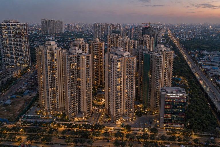 Aerial view of Heartbeat City luxury apartments in Sector 107 Noida at sunset.