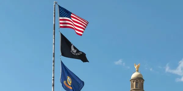 American flag raised above the capital building in Boise Idaho