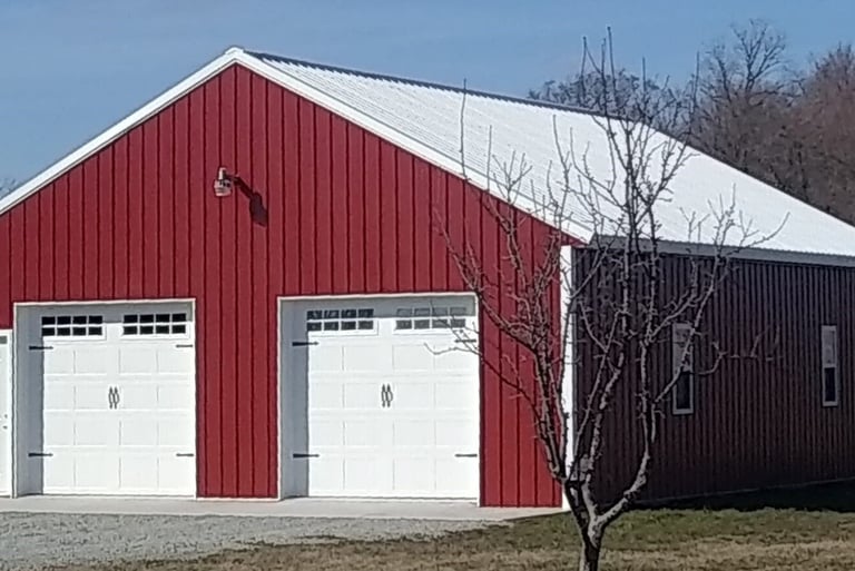 This pole barn was built in Benton, IN with two large access doors and 6 windows.