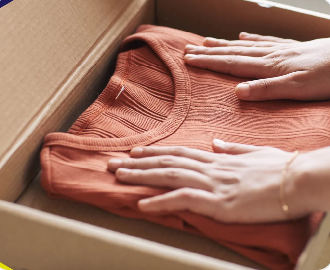 Folded shirts prepared for shipping to create a memory quilt or T-shirt quilt.