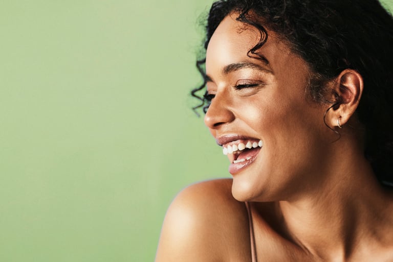 Woman laughing with fresh skin