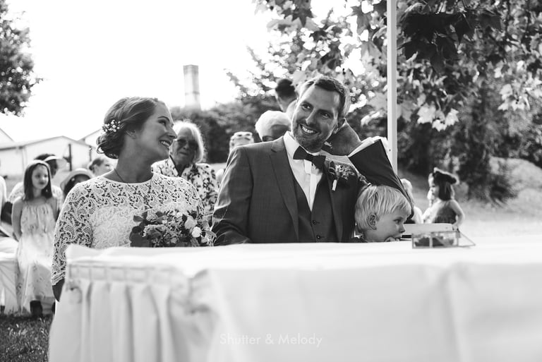 Bride and groom sitting during a wedding ceremony.