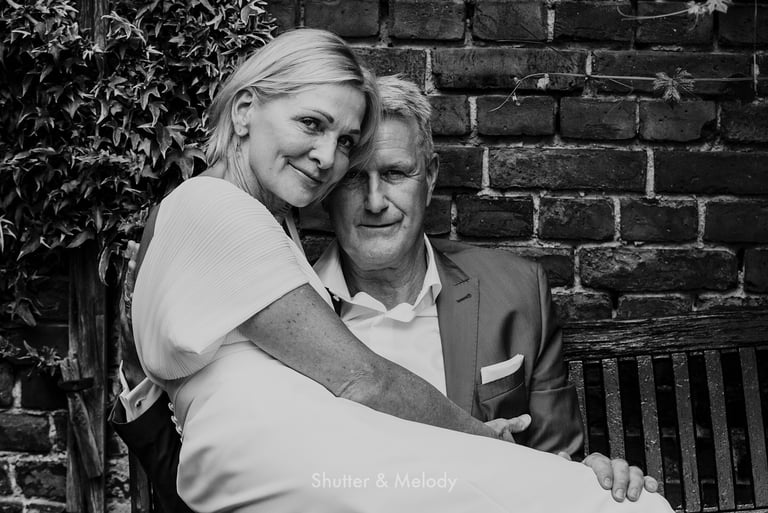 A black and white portrait of a mature wedding couple.