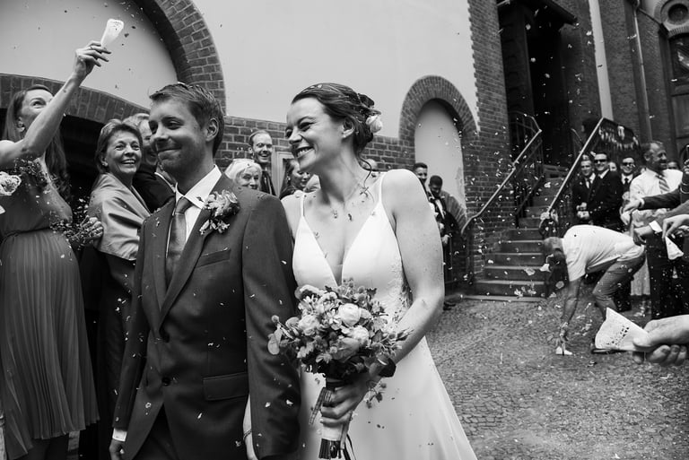 Happy bride and groom during send-off.
