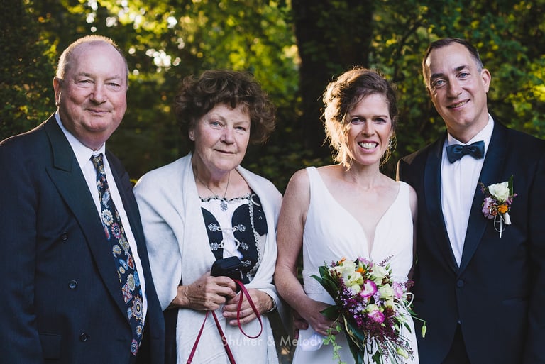 Bride and groom with parents.