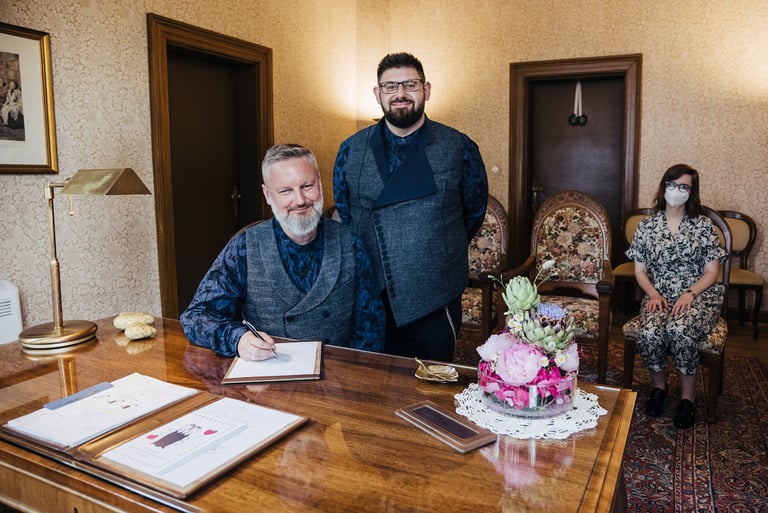 Grooms signing the marriage certificate.