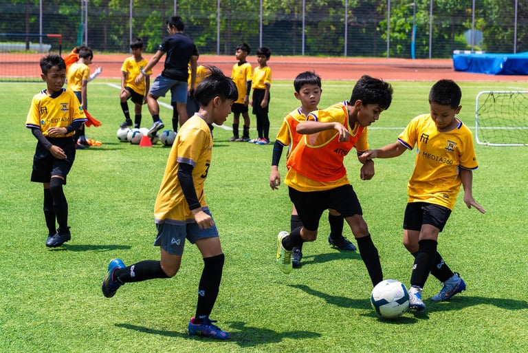 F17 Players a group of young children playing soccer on a soccer field