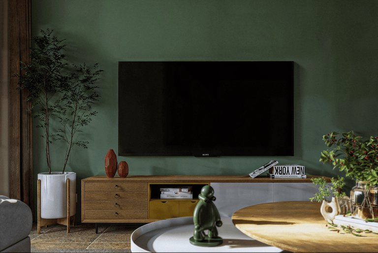 a living room with a tv and a large screen tv