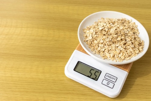 a bowl of oatmeal on a scale