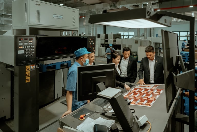 a group of people standing around a table with a chess board