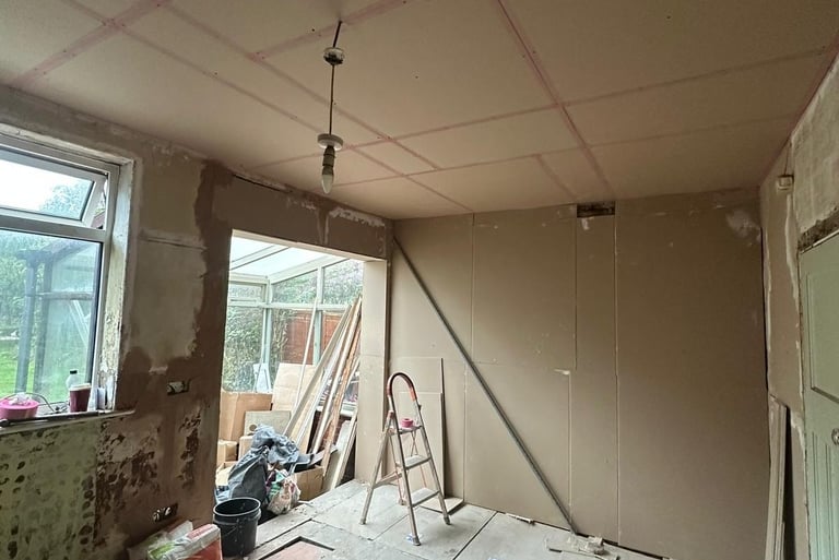 Plasterboarding to one wall almost finished and bonding used to level some areas before boarding.