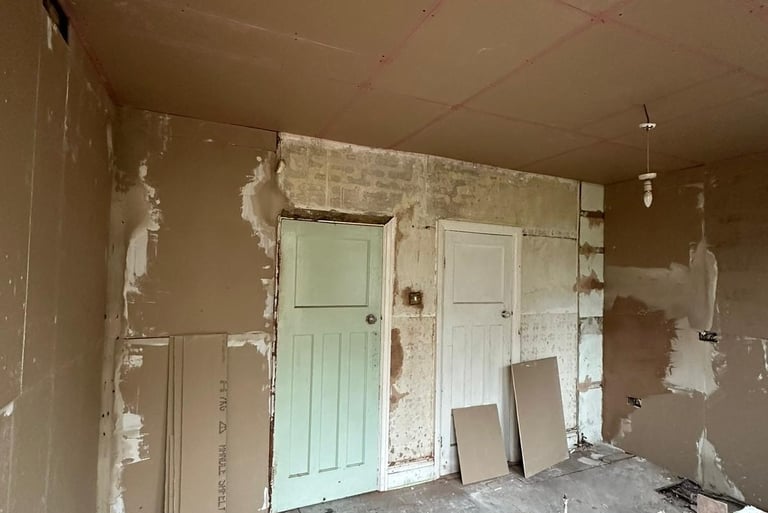Plaster boarding in progress.