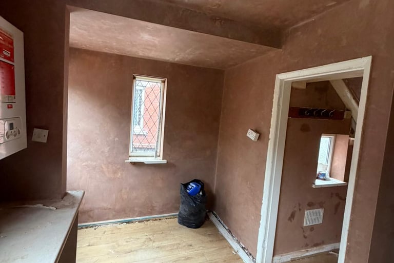 Smooth walls and ceiling ready for redecoration.