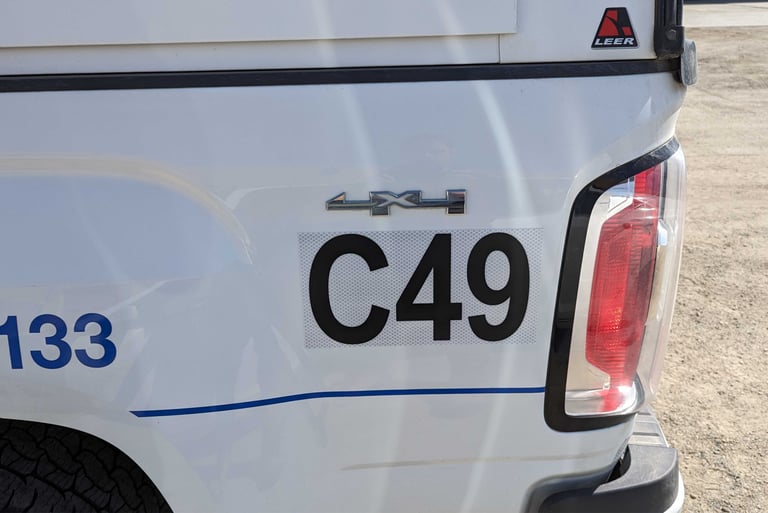 "Fleet of vehicles with uniform decals featuring consistent branding and graphics across all units."