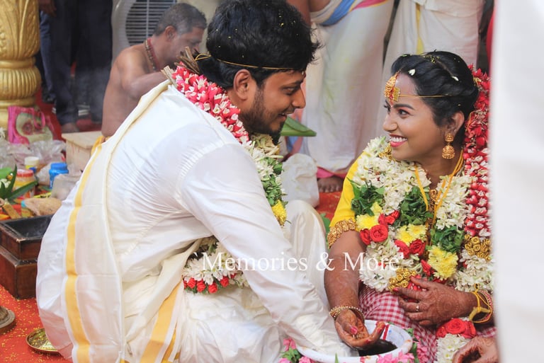 A wedding couple in traditional Indian attire during a wedding ceremony photographed by Memories and