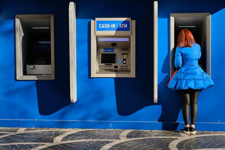 Woman getting cash from ATM