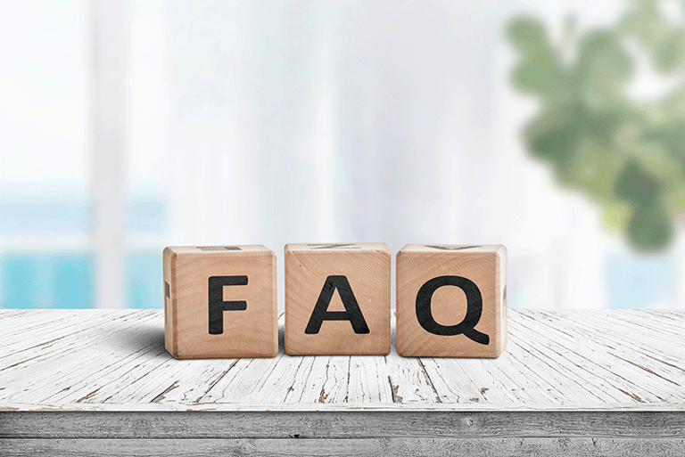 a wooden block with the word faq on it