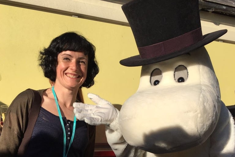 I am stood smiling next to a human-sized Moomin