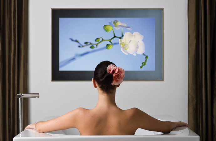 IP65-rated bathroom television mounting with hidden cabling.