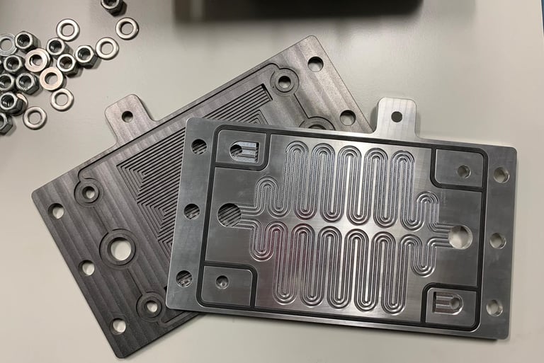 Bipolar flow plates with cooling channels for hydrogen polymer electrolyte fuel cells