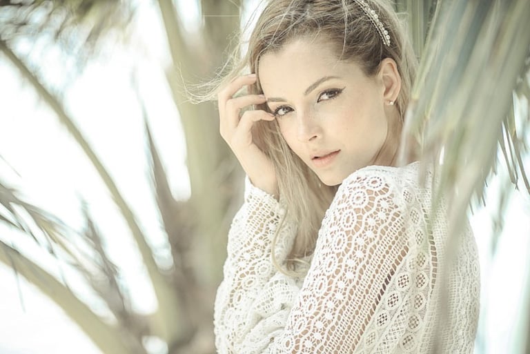 a woman in a white lace dress on koh samui in thailand