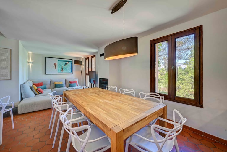 a dining room table with chairs and a couch