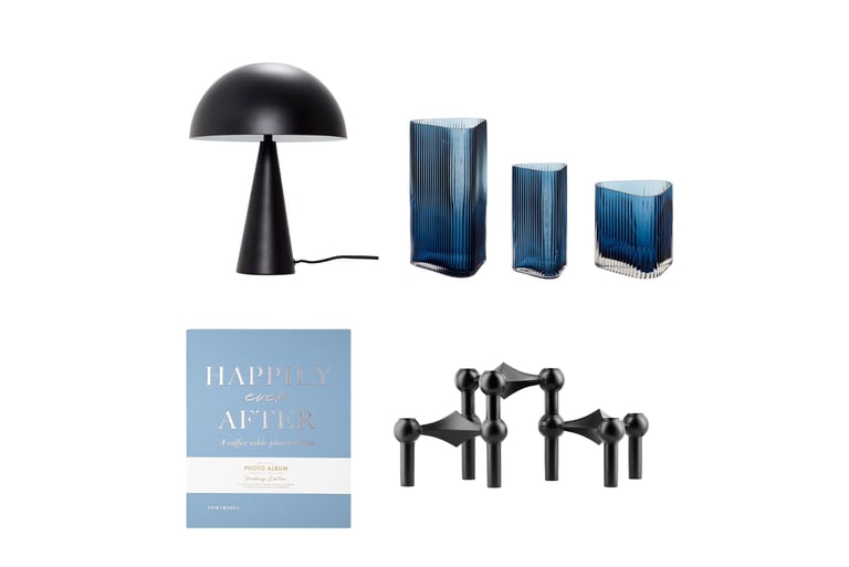 Modern home decor set featuring a black dome lamp, blue fluted glass vases, and a modular candle holder.