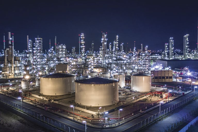 a large industrial oil refinery with a lot of tanks