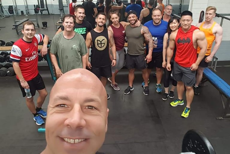 A happy group of PT client with their coach