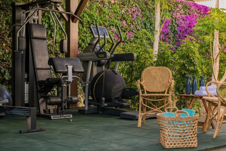 Outdoor gym amid tropical gardens at Villa El Olivo, Marbe
