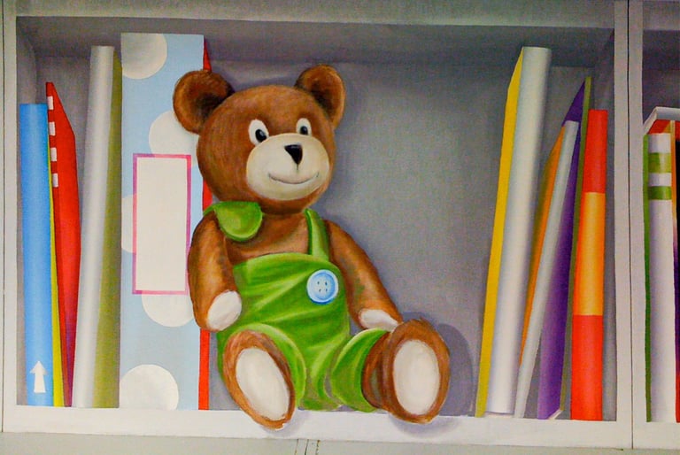 A painted bookshelf in trompe l'oeil style, showing a cute stuffed bear and fun colourful books