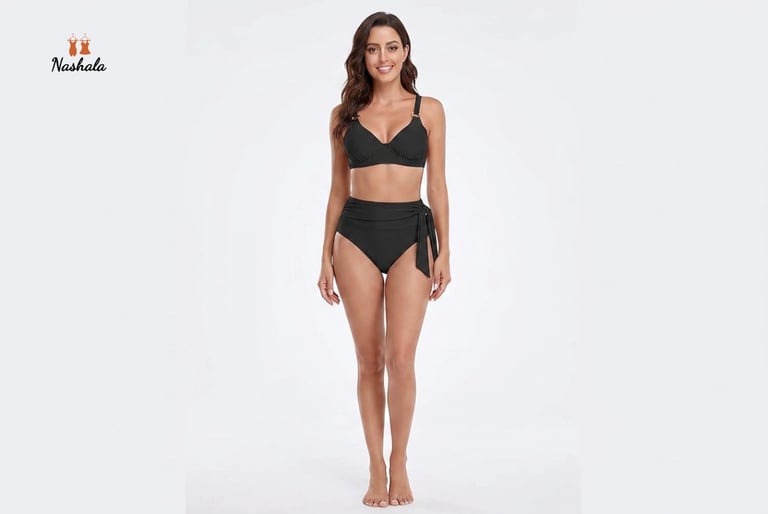 A woman modeling a black two-piece swimsuit with high-waisted bikini bottoms and an underwire top.