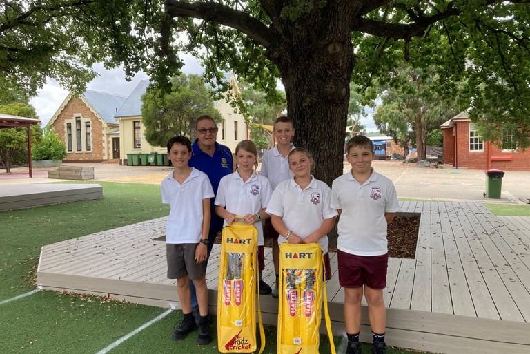 Members of QBN Public School accept the Dream Cricket sets on behalf of the school