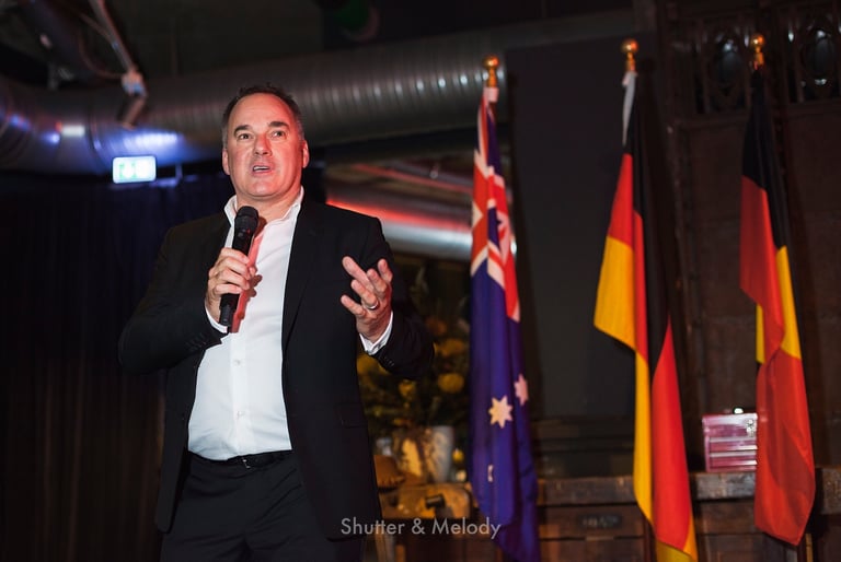 Graeme Mason speaking to guests at a Berlinale event.