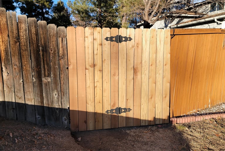 cedar picket fence gate after repair