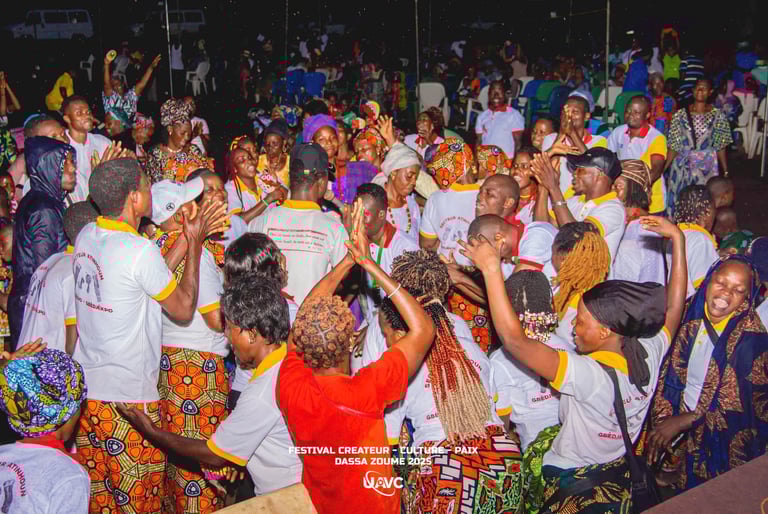 Crowd dancing and celebrating at the Festival Createur Culture Paix in Dassa-Zoume, Benin.