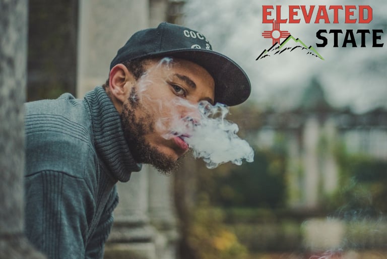 a man smoking with a logo in the background