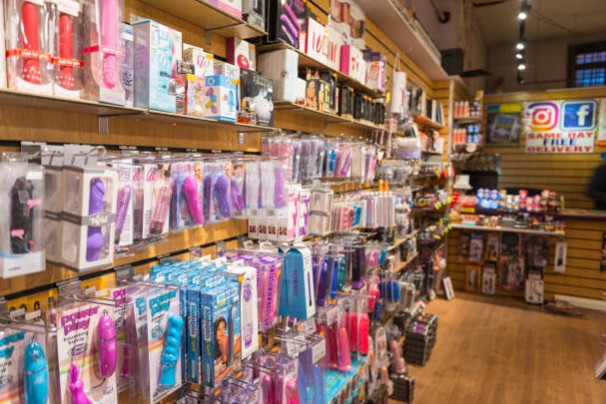 Online Adult toy shop shelves stocked with vibrators, dildos, and sexual wellness products