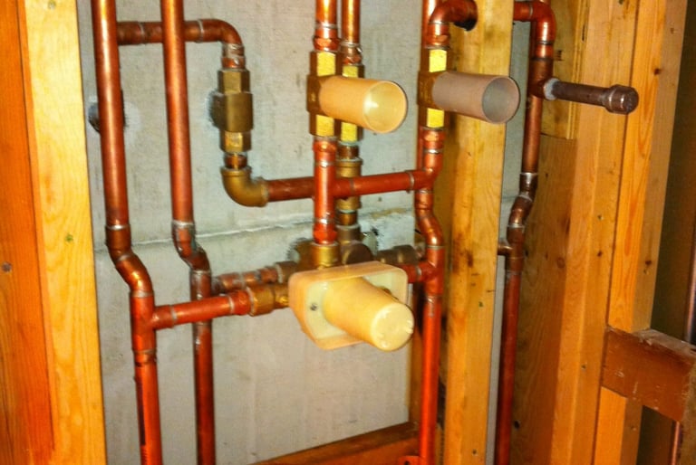 Copper plumbing pipes and shower valve installation