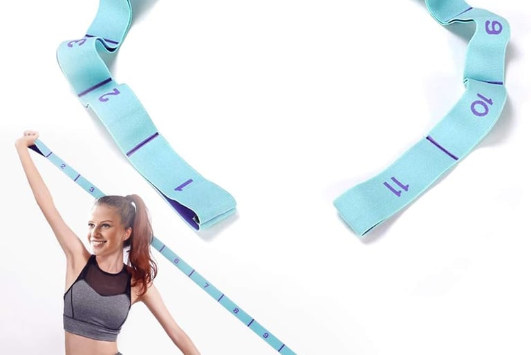 a woman is sitting on a mat with a tape measure tape measure tape