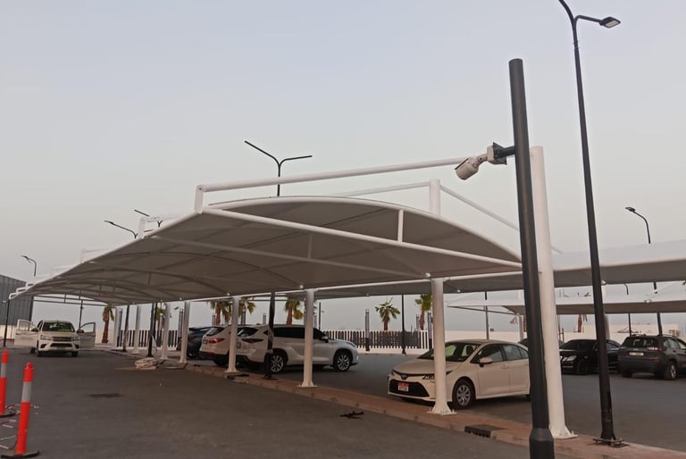 Powder-coated mild steel parking shade structure with high-quality PVC fabric.