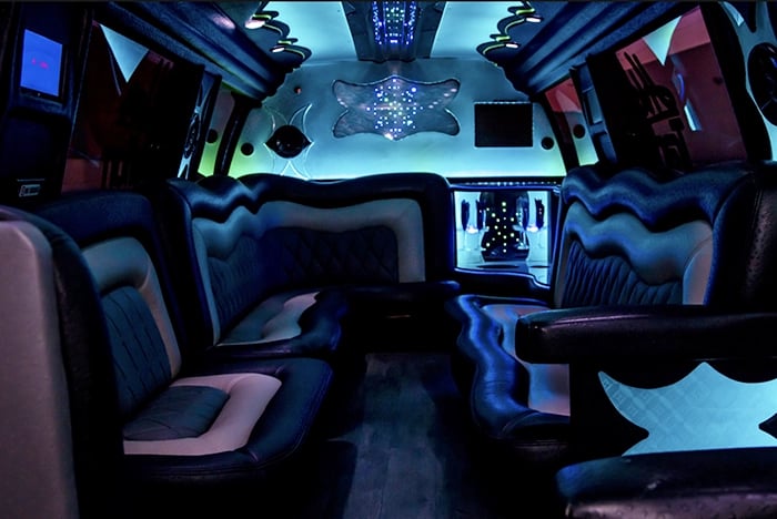 a bus with a lot of seats and a laptop