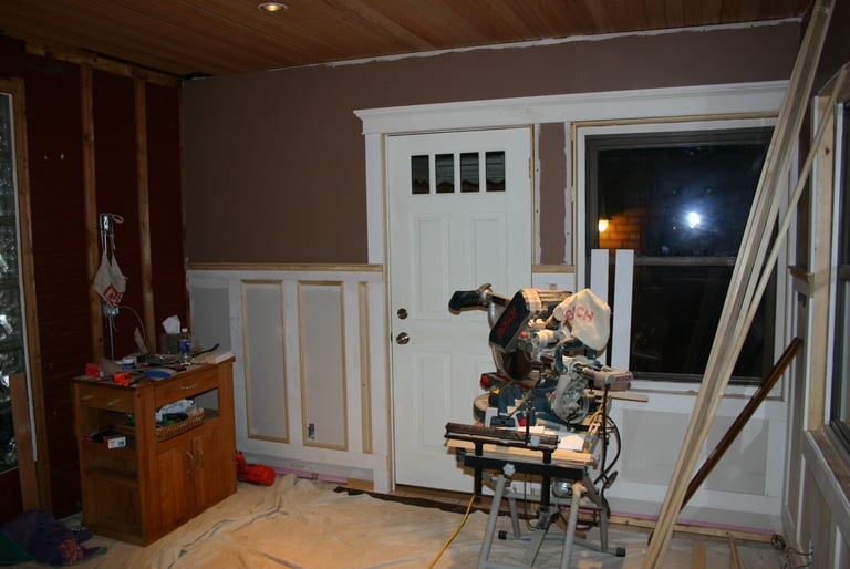New drywall, custom trim and wainscotting along with a fresh coat of paint.