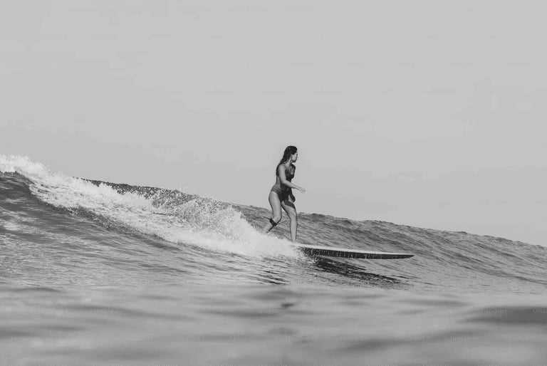 Woman surfing at Santa Teresa, Costa Rica