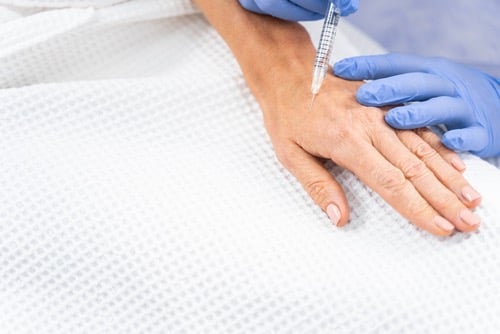 Hand rejuvenation treatments with boosters and fillers
